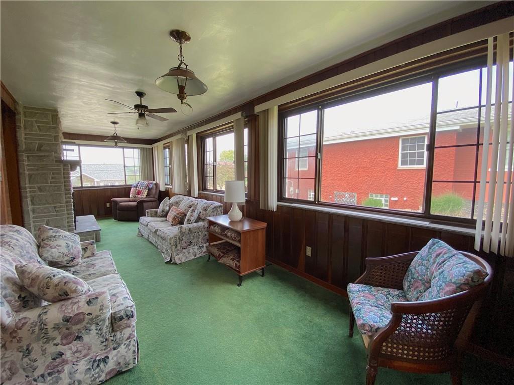 560 Center Hill Road Pittsburgh, PA 15239 - Photo 11 of 25 a living room with furniture and a large window
