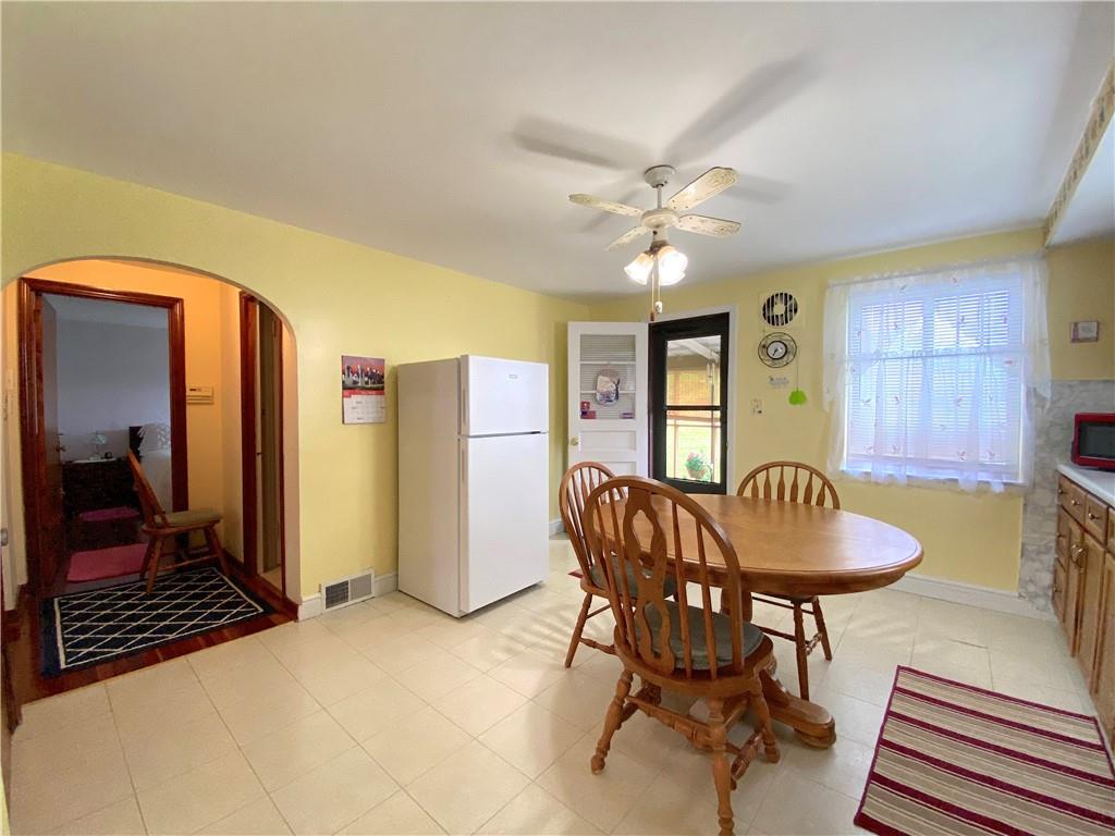 560 Center Hill Road Pittsburgh, PA 15239 - Photo 16 of 25 a dining room with furniture and window