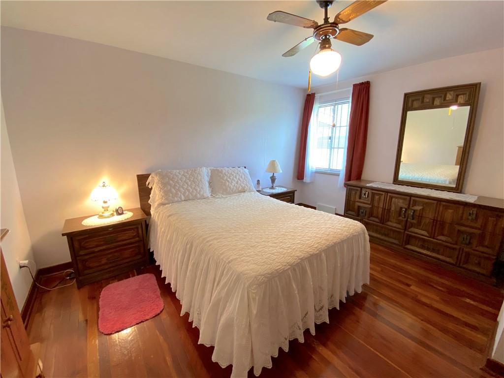 560 Center Hill Road Pittsburgh, PA 15239 - Photo 17 of 25 a bedroom with a bed and window