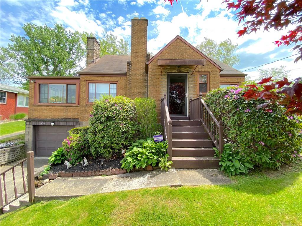 560 Center Hill Road Pittsburgh, PA 15239 - Photo 2 of 25 a front view of a house with garden