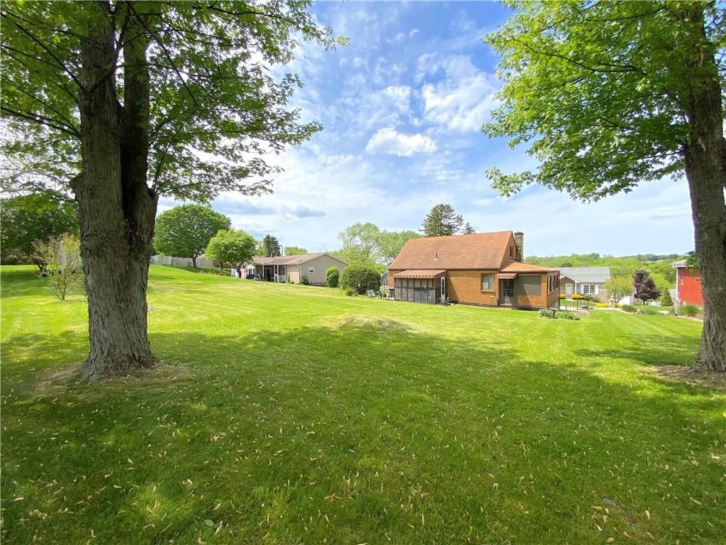 560 Center Hill Road Pittsburgh, PA 15239 - Photo 23 of 25 a view of a garden with large trees