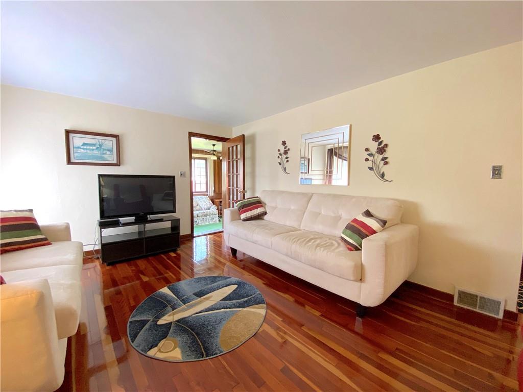 560 Center Hill Road Pittsburgh, PA 15239 - Photo 5 of 25 a living room with furniture and a flat screen tv