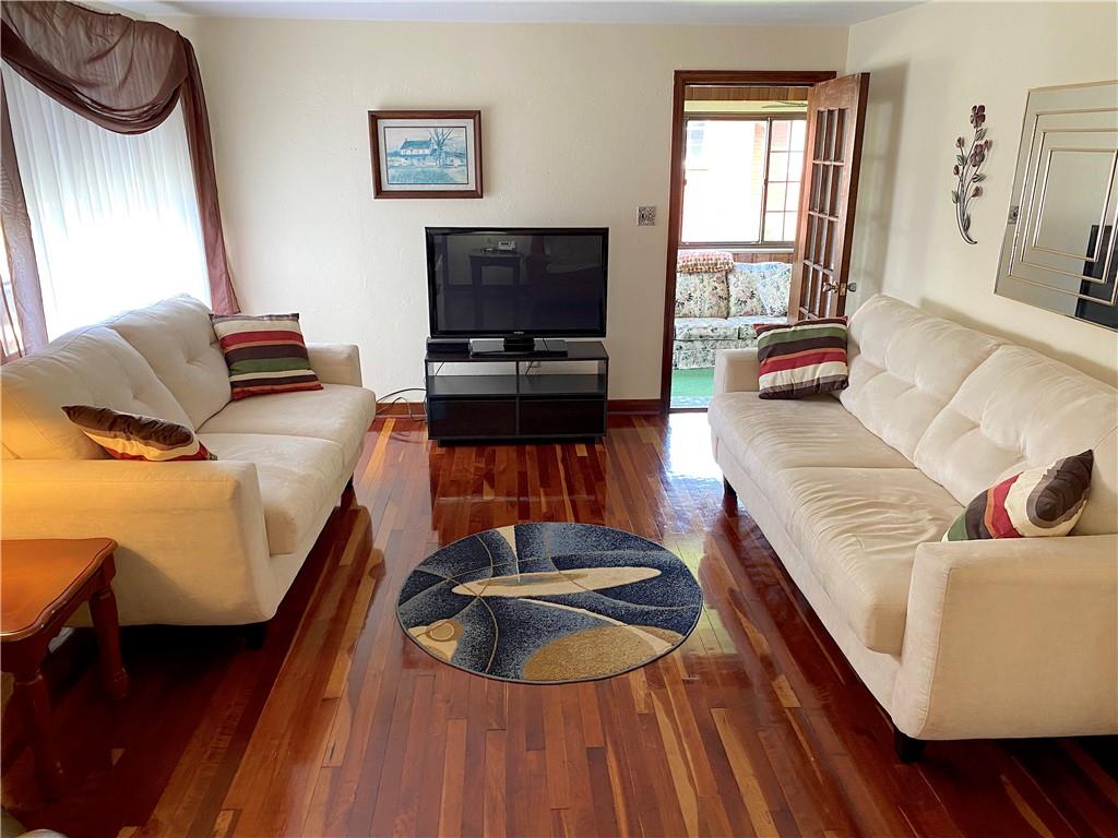 560 Center Hill Road Pittsburgh, PA 15239 - Photo 6 of 25 a living room with furniture and a flat screen tv