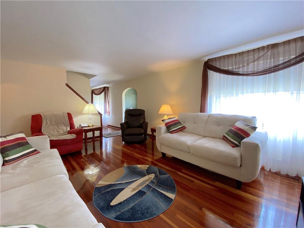560 Center Hill Road Pittsburgh, PA 15239 - Photo 8 of 25 a living room with furniture and a wooden floor