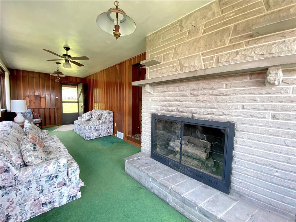 560 Center Hill Road Pittsburgh, PA 15239 - Photo 10 of 25 a living room with furniture and a fireplace