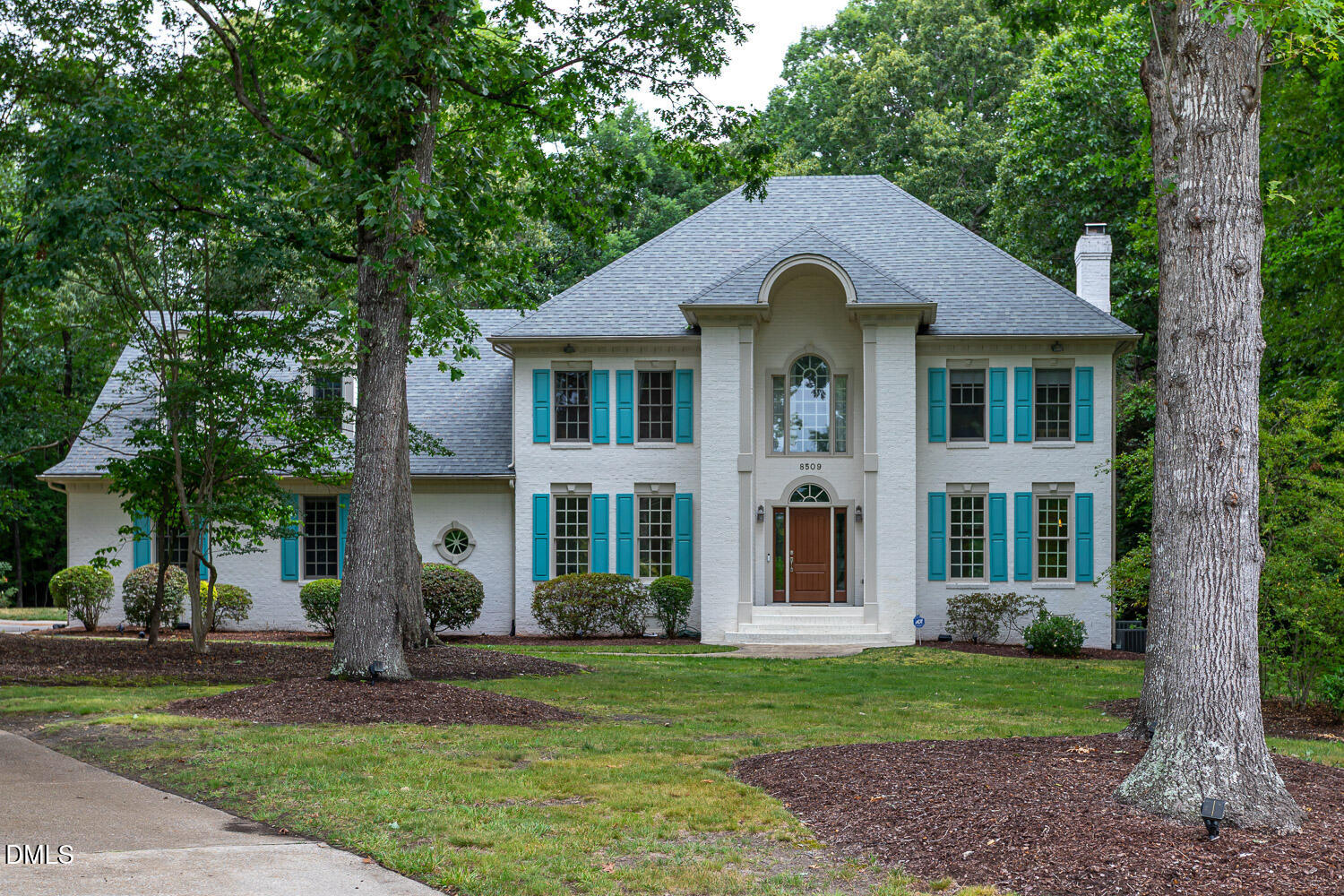 8509 Towneley Place Raleigh, NC 27615 - Photo 1 of 36 a front view of a house with a yard