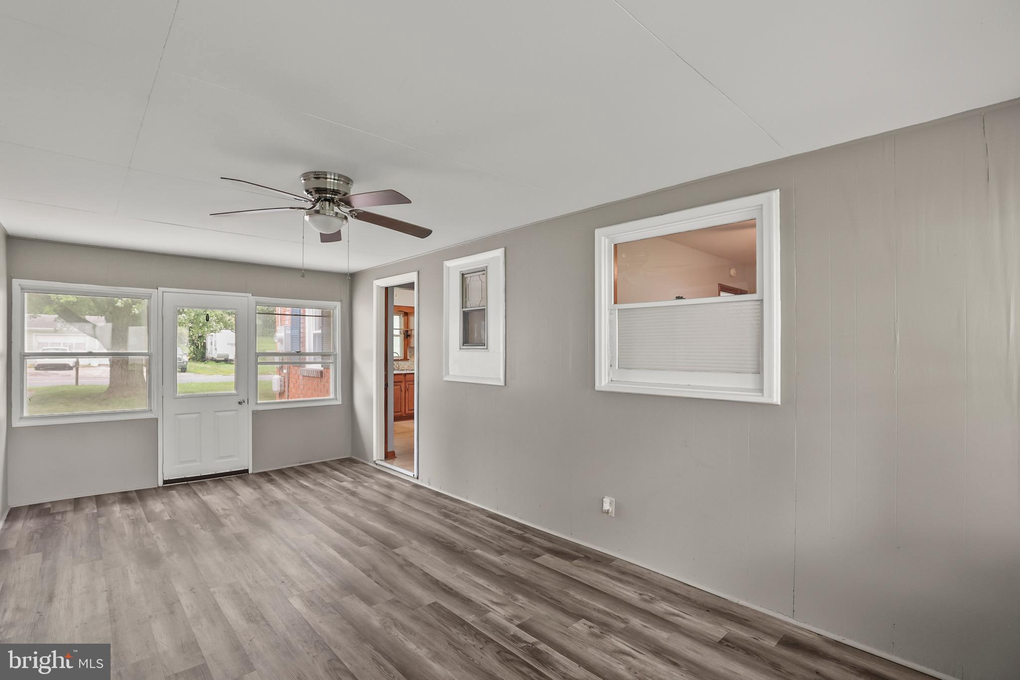 2152 White Hall Road Littlestown, PA 17340 - Photo 11 of 46 a view of empty room with wooden floor and fan
