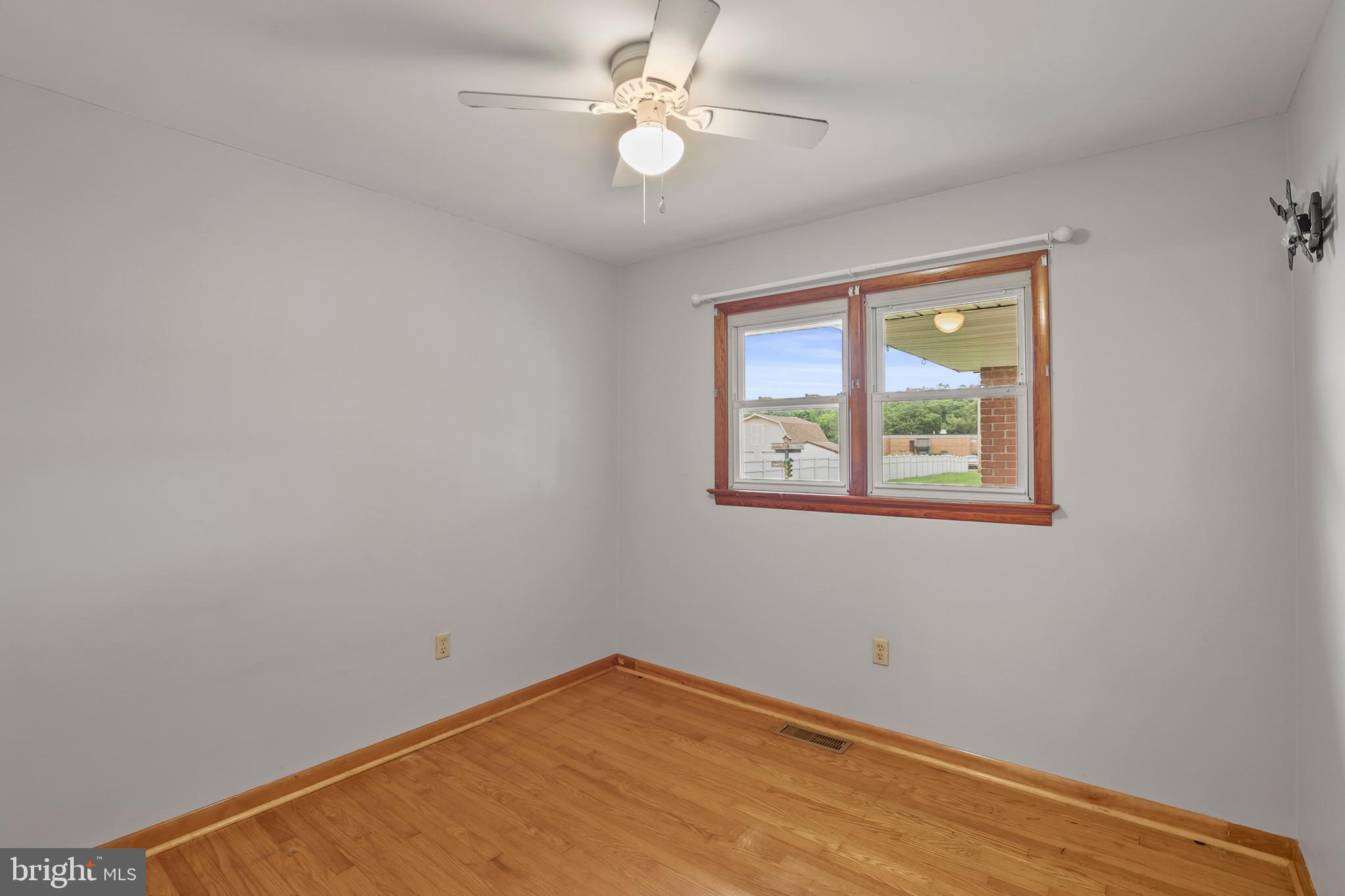 2152 White Hall Road Littlestown, PA 17340 - Photo 15 of 46 an empty room with windows and fan