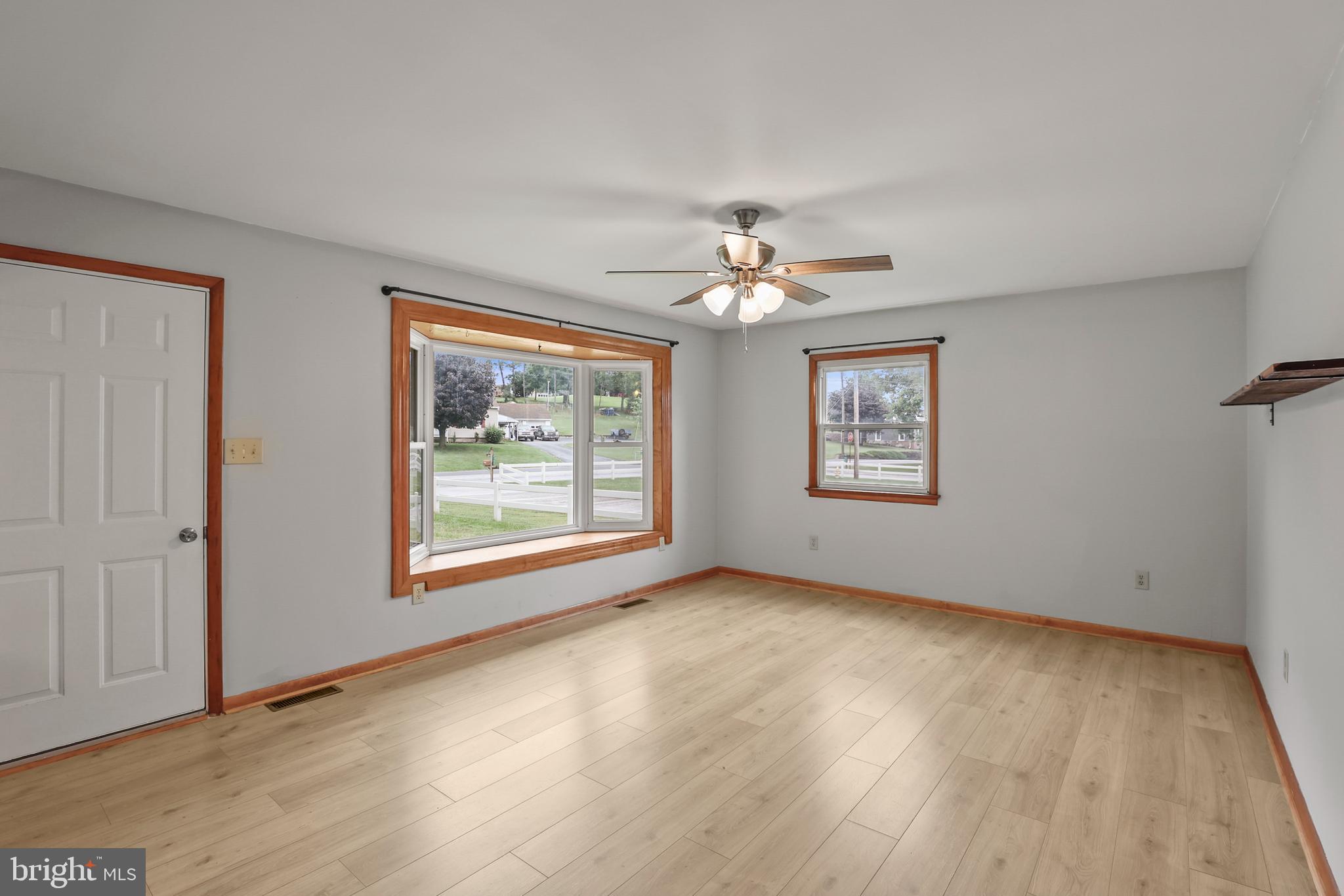 2152 White Hall Road Littlestown, PA 17340 - Photo 3 of 46 a view of an empty room with a window and wooden floor