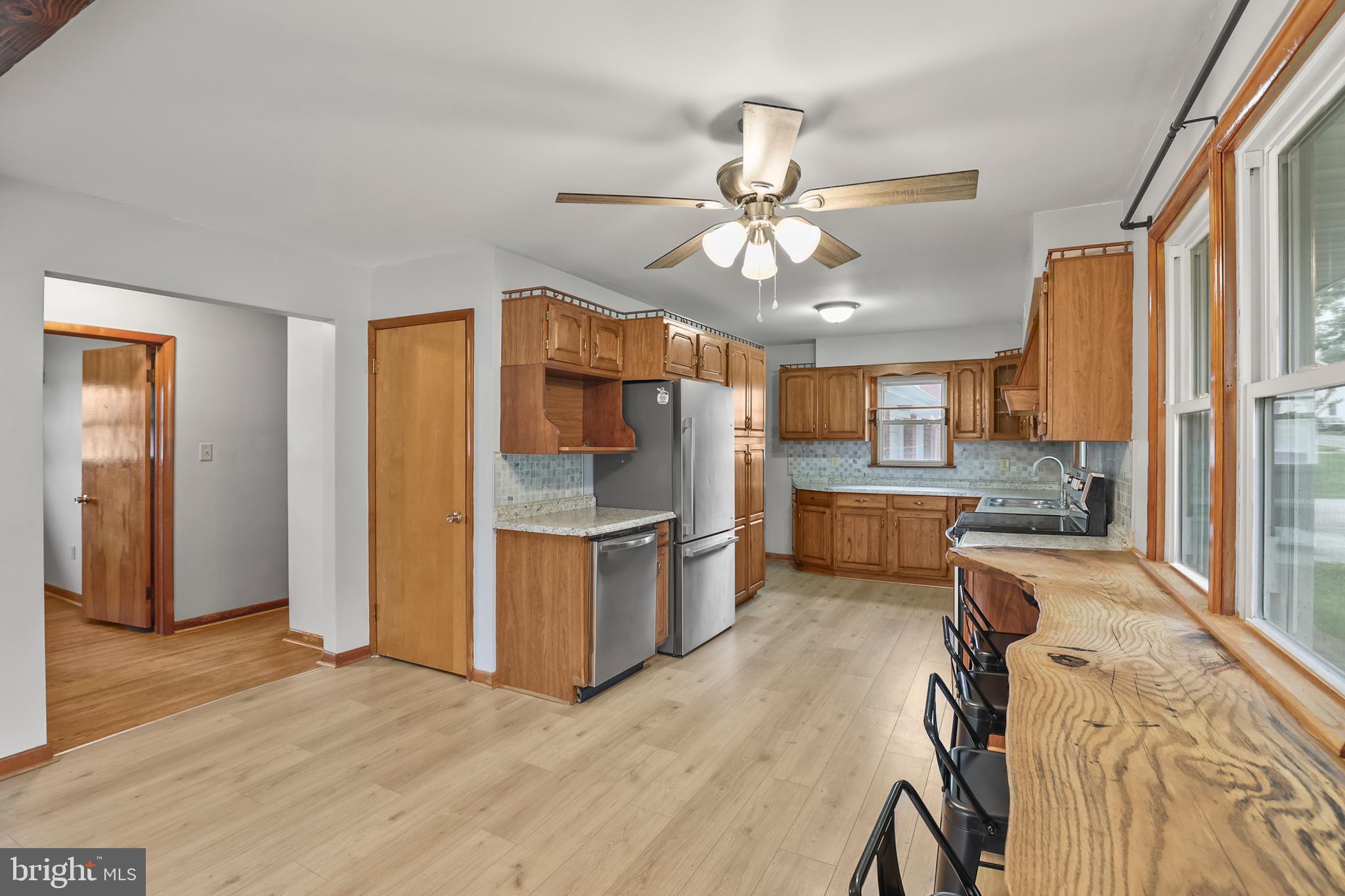 2152 White Hall Road Littlestown, PA 17340 - Photo 6 of 46 a view of a kitchen with a sink wooden floor and a kitchen