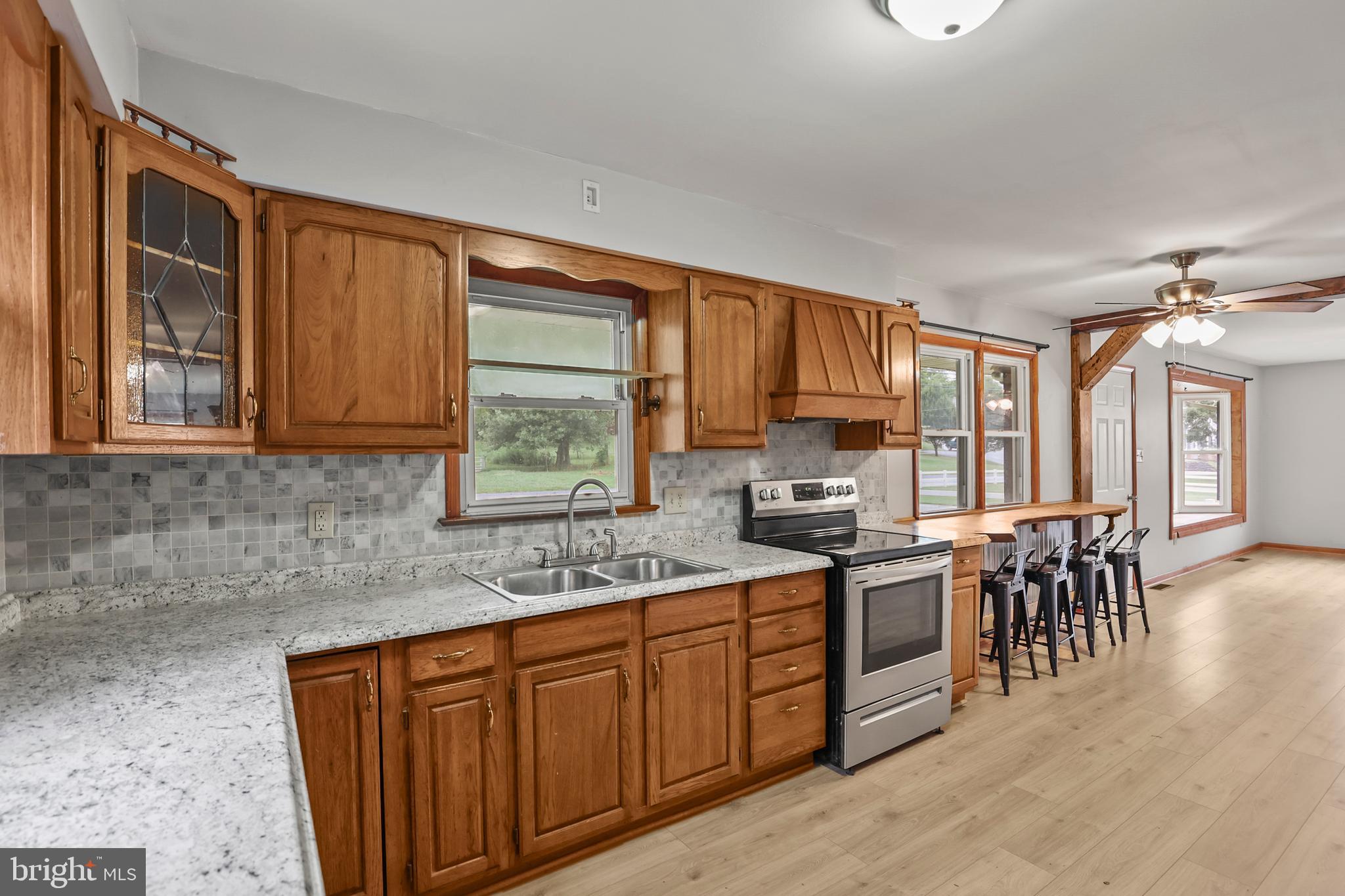 2152 White Hall Road Littlestown, PA 17340 - Photo 8 of 46 a kitchen with stainless steel appliances granite countertop sink stove top oven and cabinets