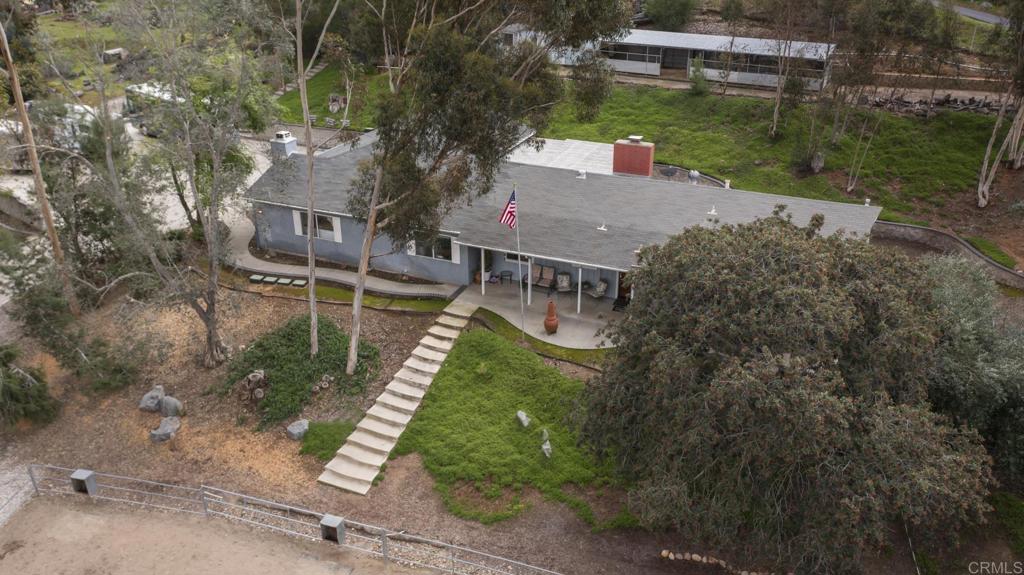 11311 Manzanita Road Lakeside, CA 92040 - Photo 1 of 1 an aerial view of a house with a yard basket ball court and outdoor seating