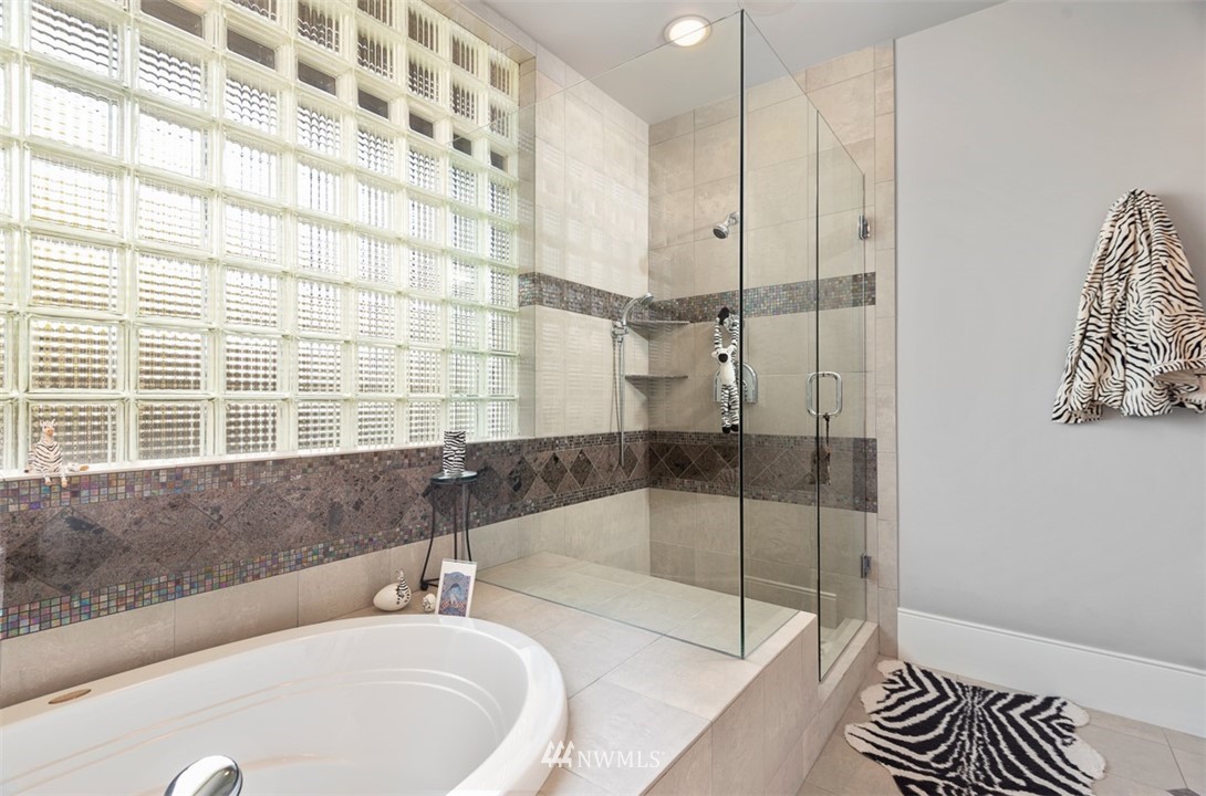 925 Park Road Bellevue, WA 98004 - Photo 19 of 25 a bathroom with a bathtub and a shower