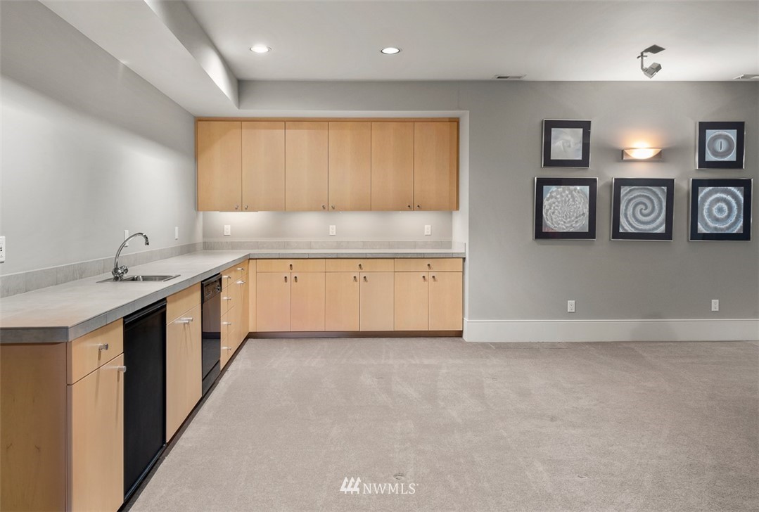 925 Park Road Bellevue, WA 98004 - Photo 22 of 25 a kitchen with granite countertop a sink and a stove top oven