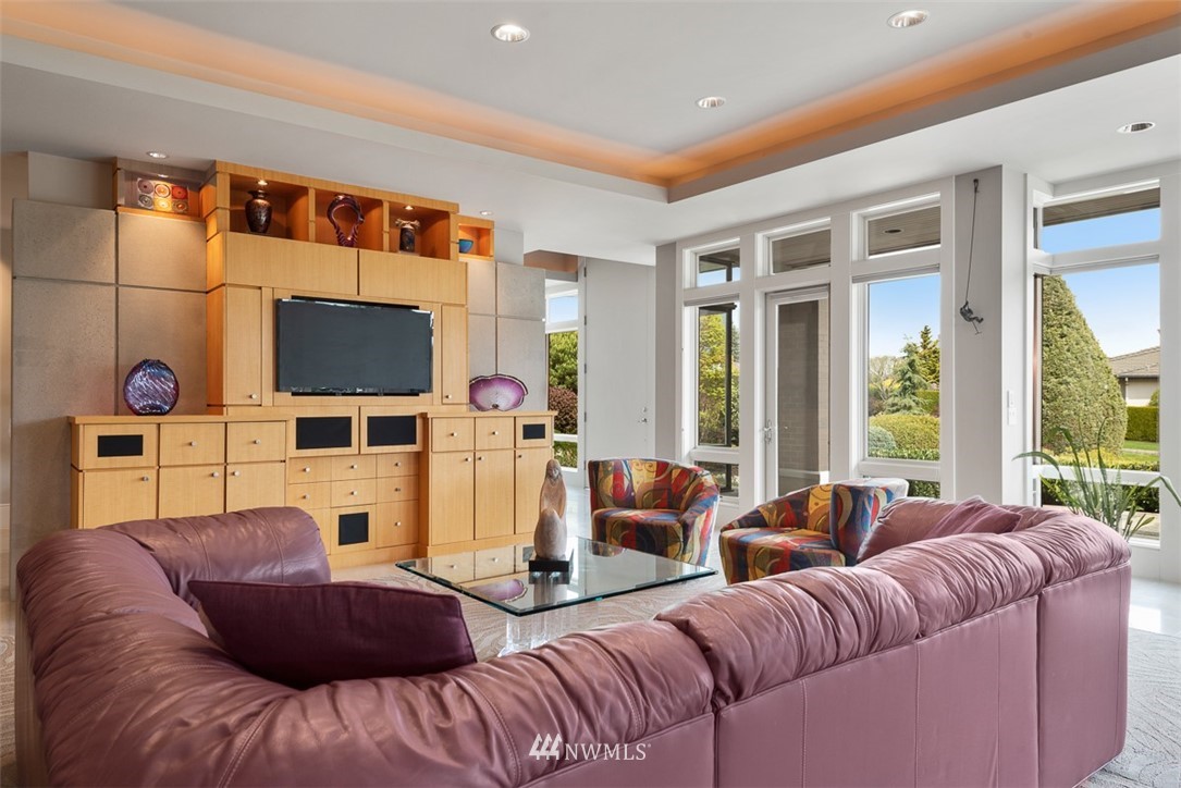 925 Park Road Bellevue, WA 98004 - Photo 6 of 25 a living room with furniture a flat screen tv and a fireplace