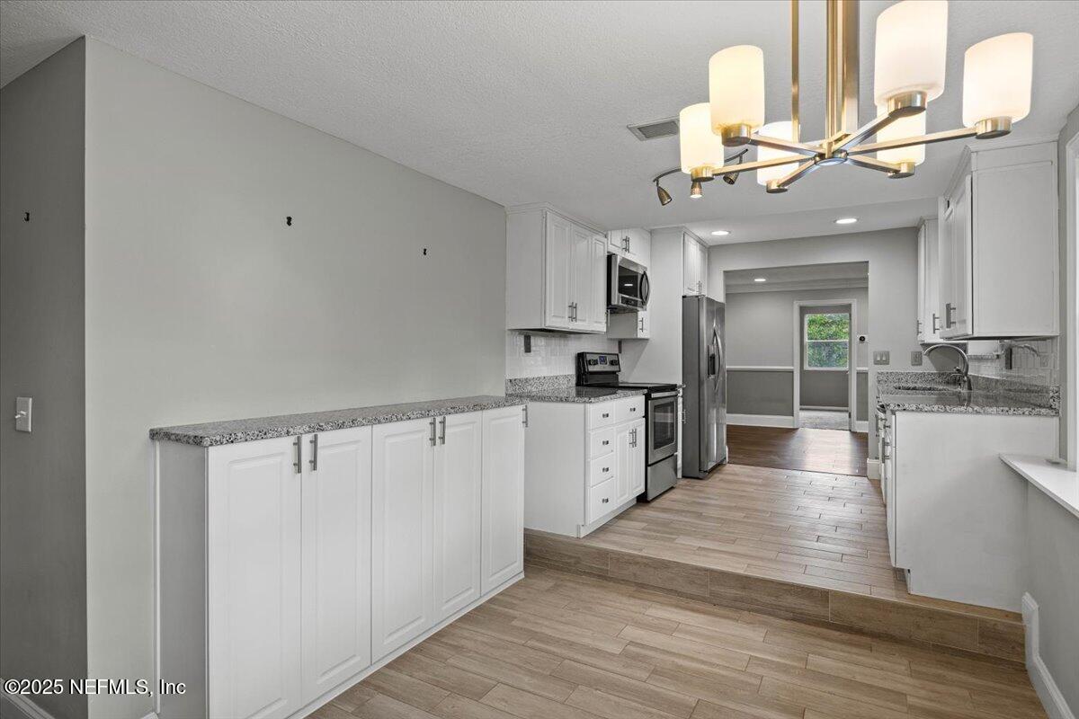 1140 Hickman Road Jacksonville, FL 32216 - Photo 12 of 49 Kitchen with Breakfast Area