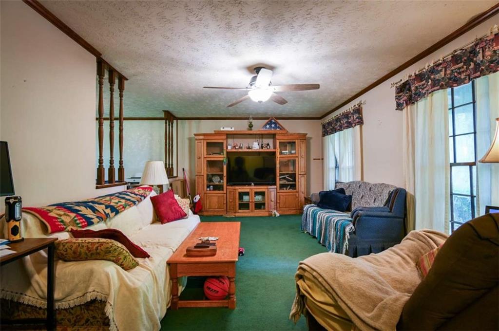 17 Valley Trail Covington, GA 30014 - Photo 2 of 19 a bedroom with furniture and a large window