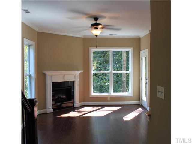 2101 Scarlet Maple Drive Raleigh, NC 27606 - Photo 2 of 18 a view of an empty room with window and fire place