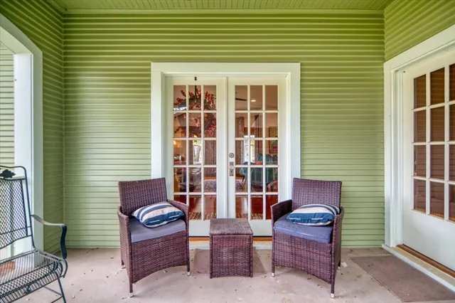 a outdoor living area with furniture and a window
