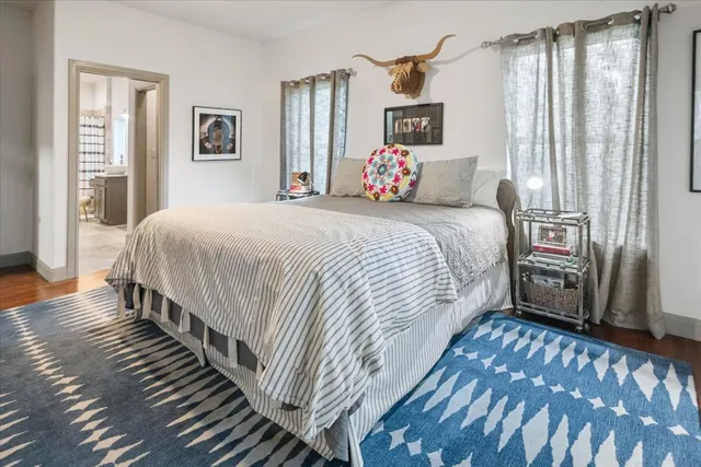 a bedroom with bed and a window