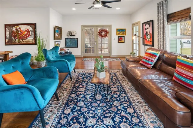 a living room with furniture and a rug