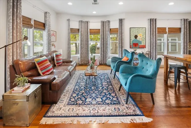 a living room with furniture and a rug