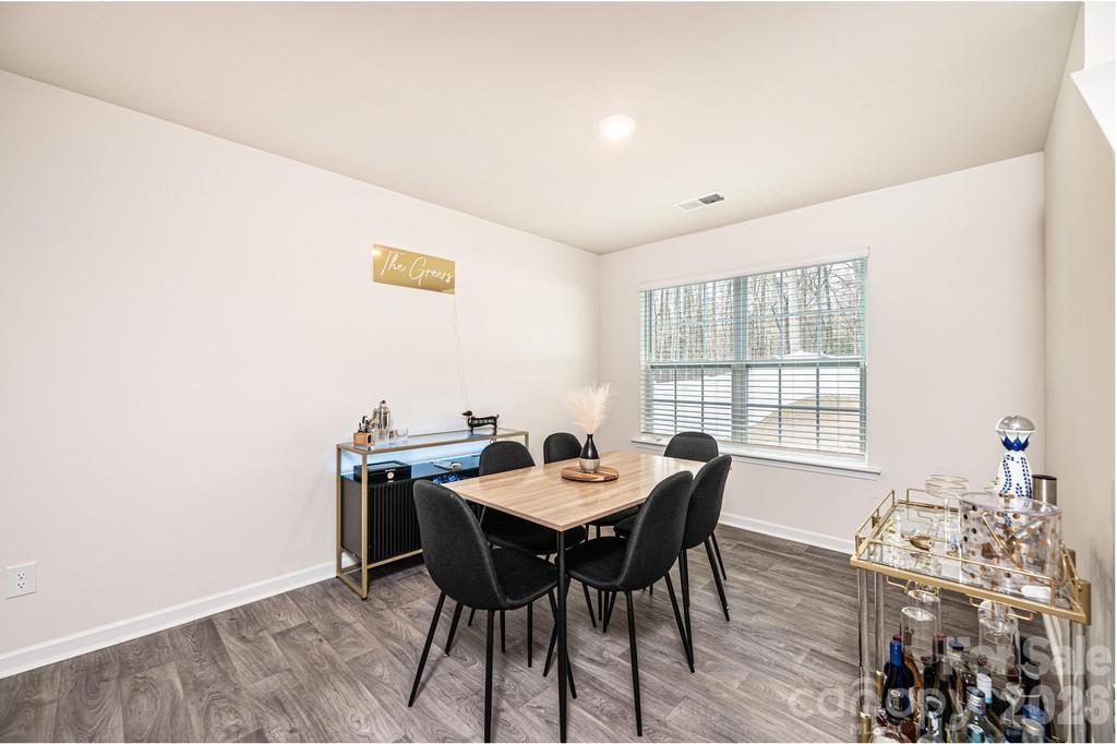 1808 Bright Hope Lane Dallas, NC 28034 - Photo 15 of 44 a view of a dining room with furniture and wooden floor