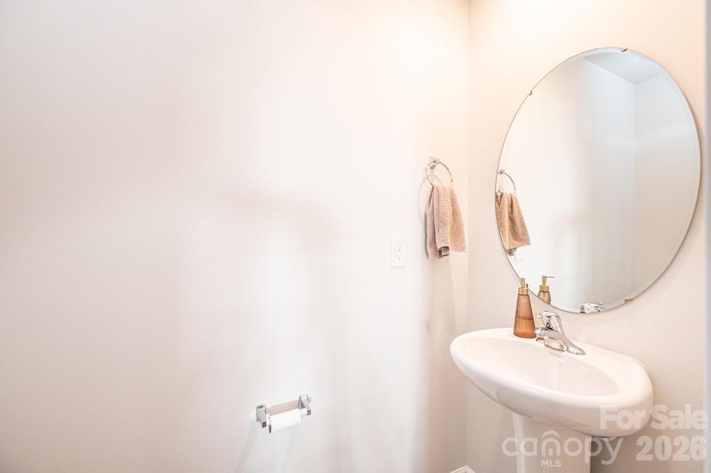 1808 Bright Hope Lane Dallas, NC 28034 - Photo 22 of 44 a bathroom with a sink a mirror and vanity