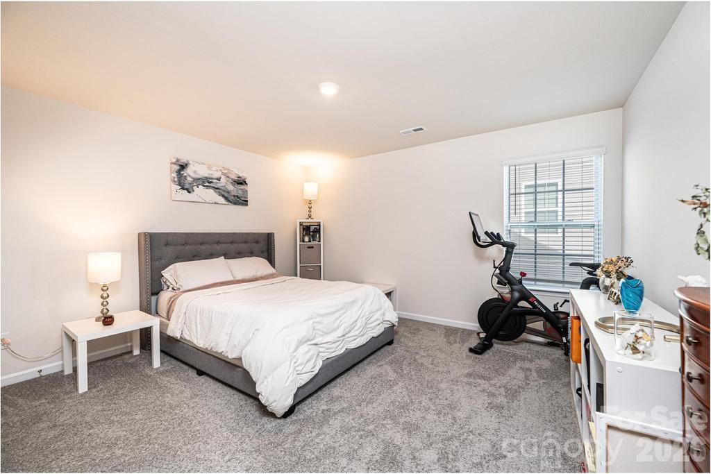 1808 Bright Hope Lane Dallas, NC 28034 - Photo 25 of 44 a bedroom with a bed and a dresser
