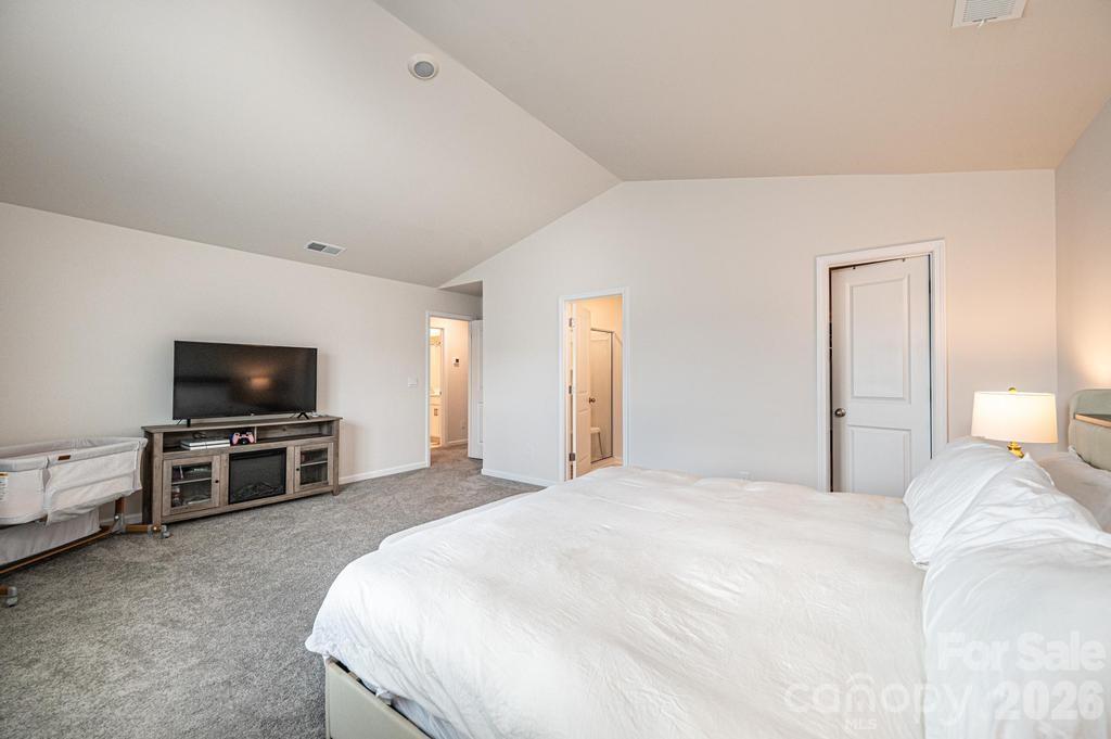 1808 Bright Hope Lane Dallas, NC 28034 - Photo 39 of 44 a bedroom with a bed and a television in it