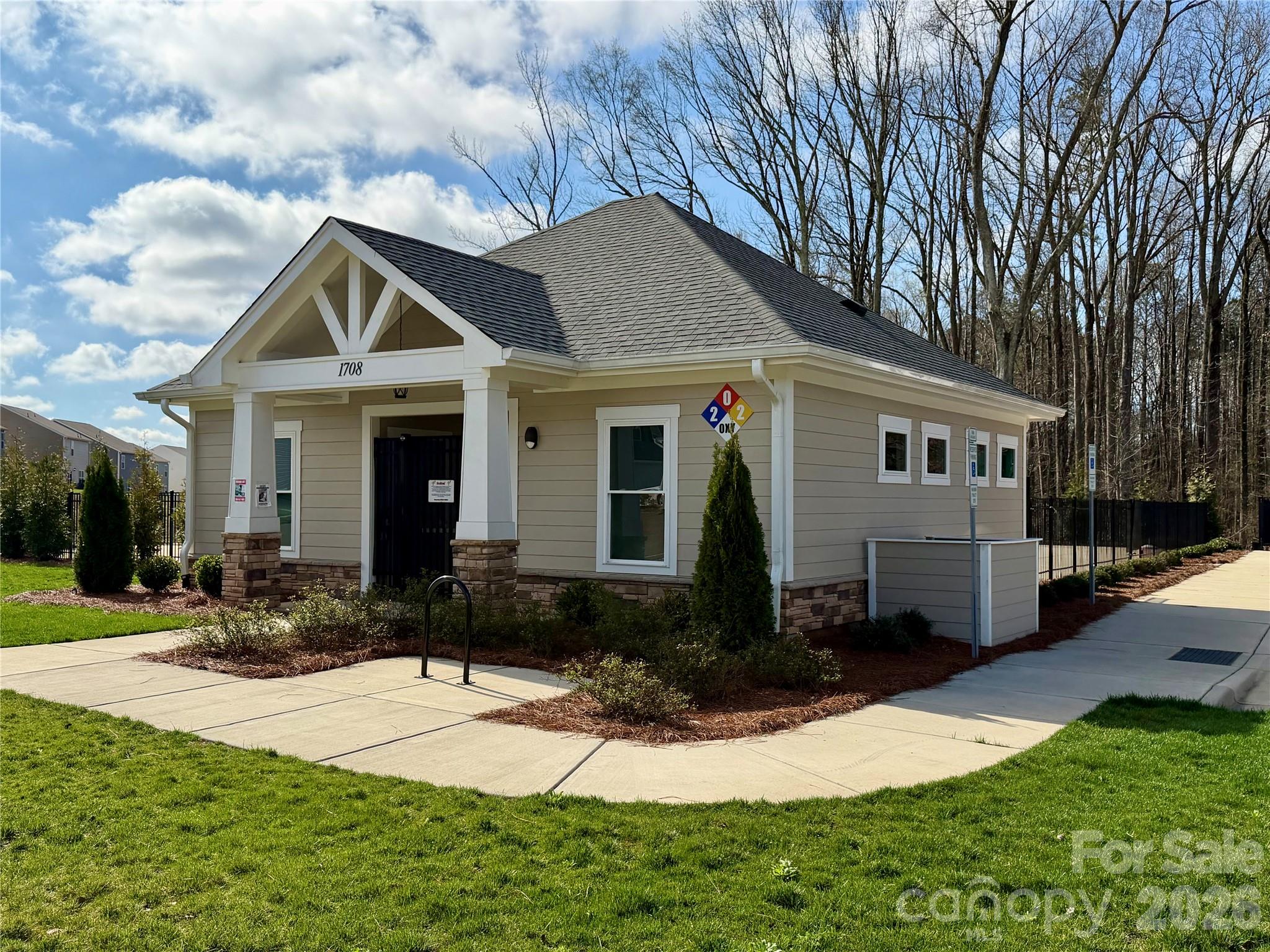 1808 Bright Hope Lane Dallas, NC 28034 - Photo 42 of 44 a front view of a house with yard and green space