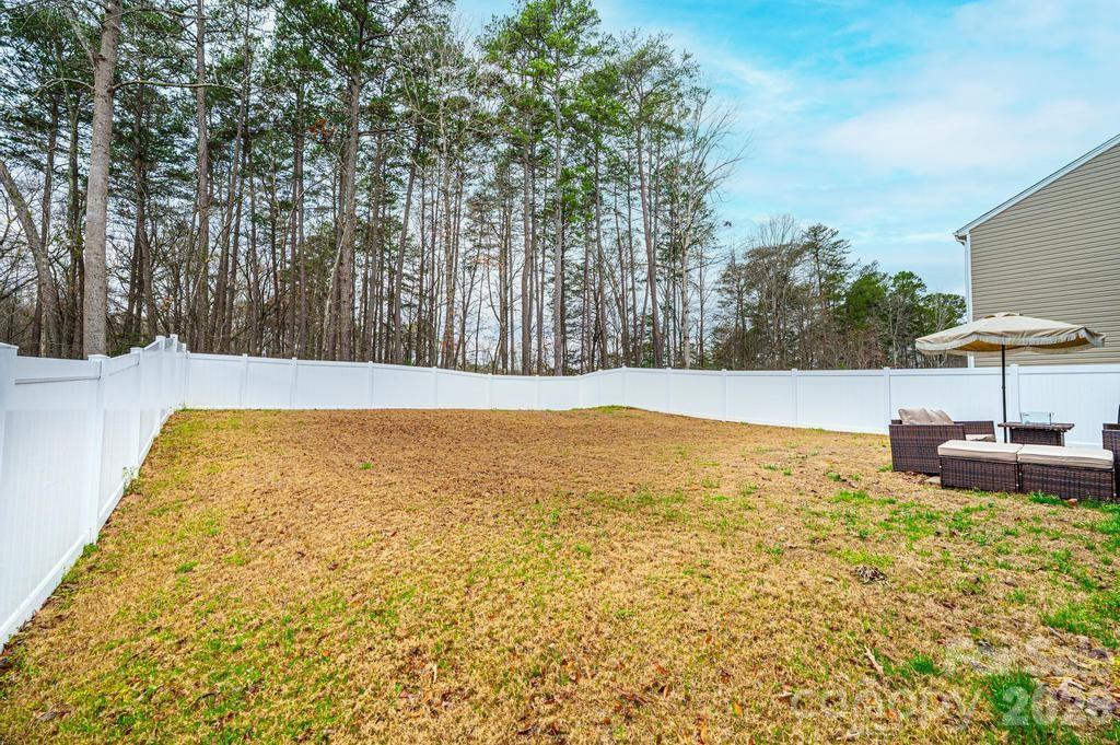 1808 Bright Hope Lane Dallas, NC 28034 - Photo 5 of 44 a view of pool with table and chairs under an umbrella