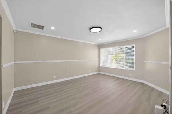 a large kitchen with stainless steel appliances granite countertop a refrigerator and a sink