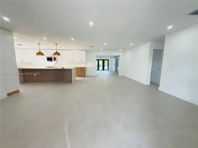 a view of workspace with wooden floor