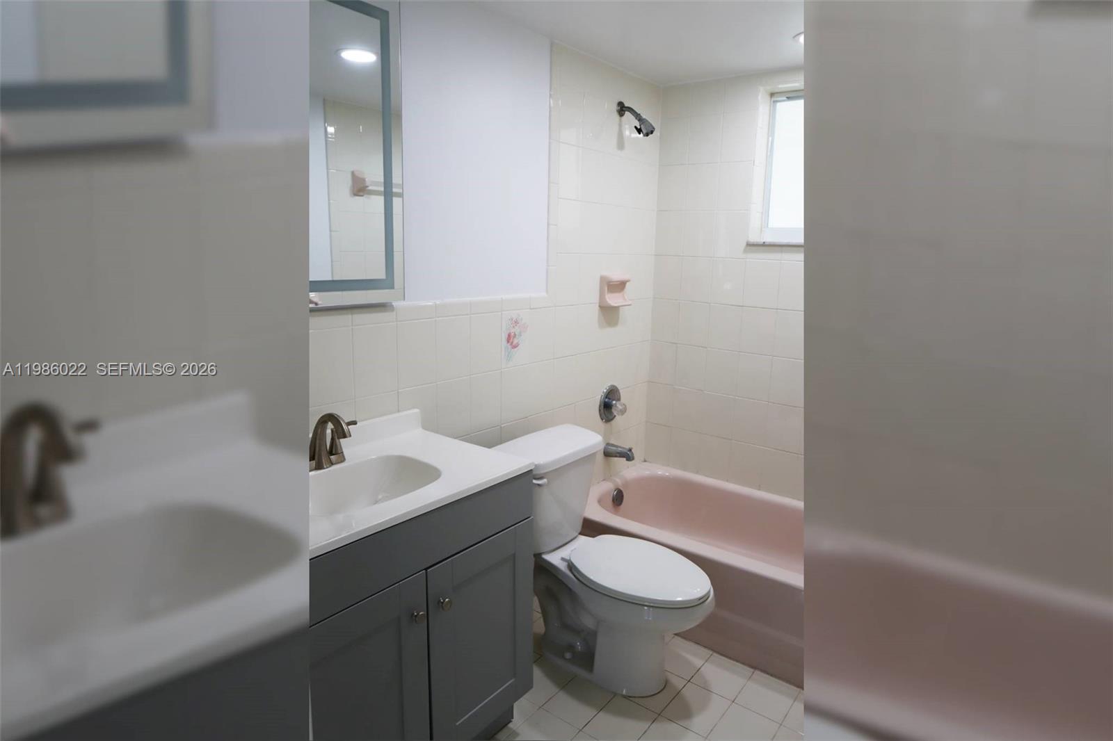 10101 West Okeechobee Road, Unit 12101 Hialeah Gardens, FL 33016 - Photo 5 of 12 a bathroom with a sink a toilet and shower