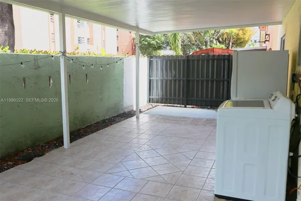 a view of a balcony with furniture