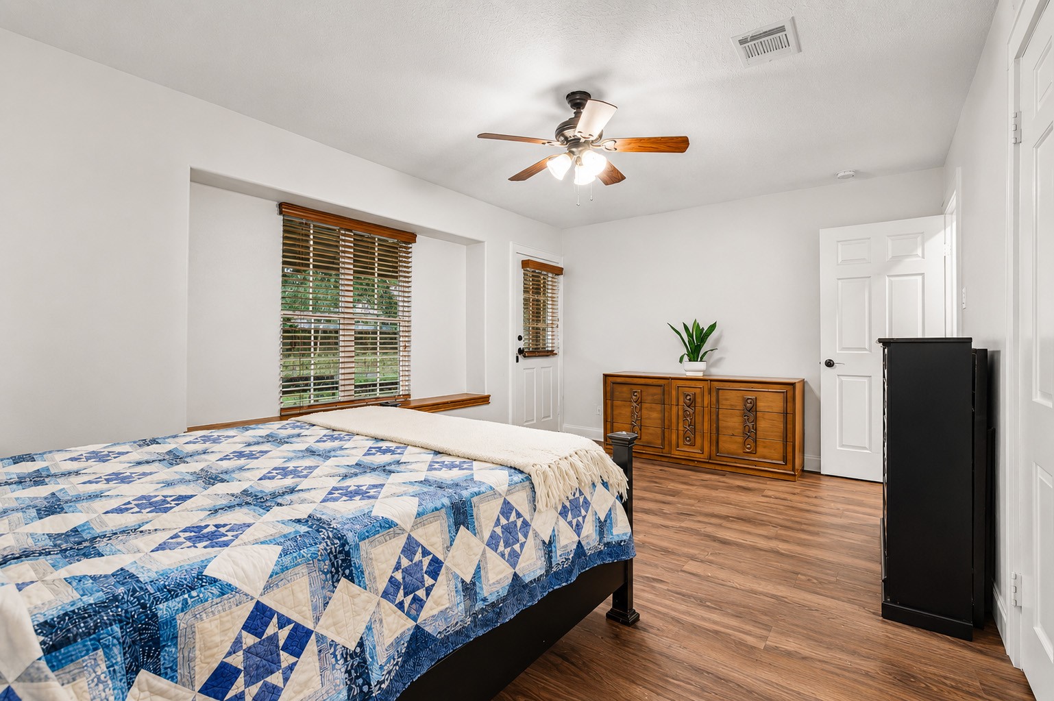 312 Springwood Drive Conroe, TX 77385 - Photo 24 of 50 The Primary Bedroom provides plenty of room for large furniture and a sitting area.