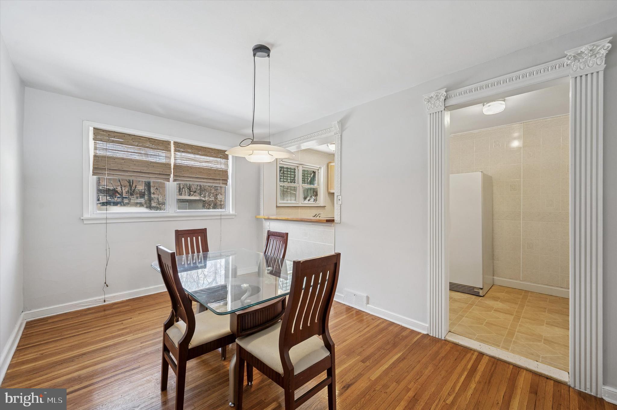 6320 Everett Street Philadelphia, PA 19149 - Photo 2 of 12 a view of a dining room with furniture wooden floor and chandelier
