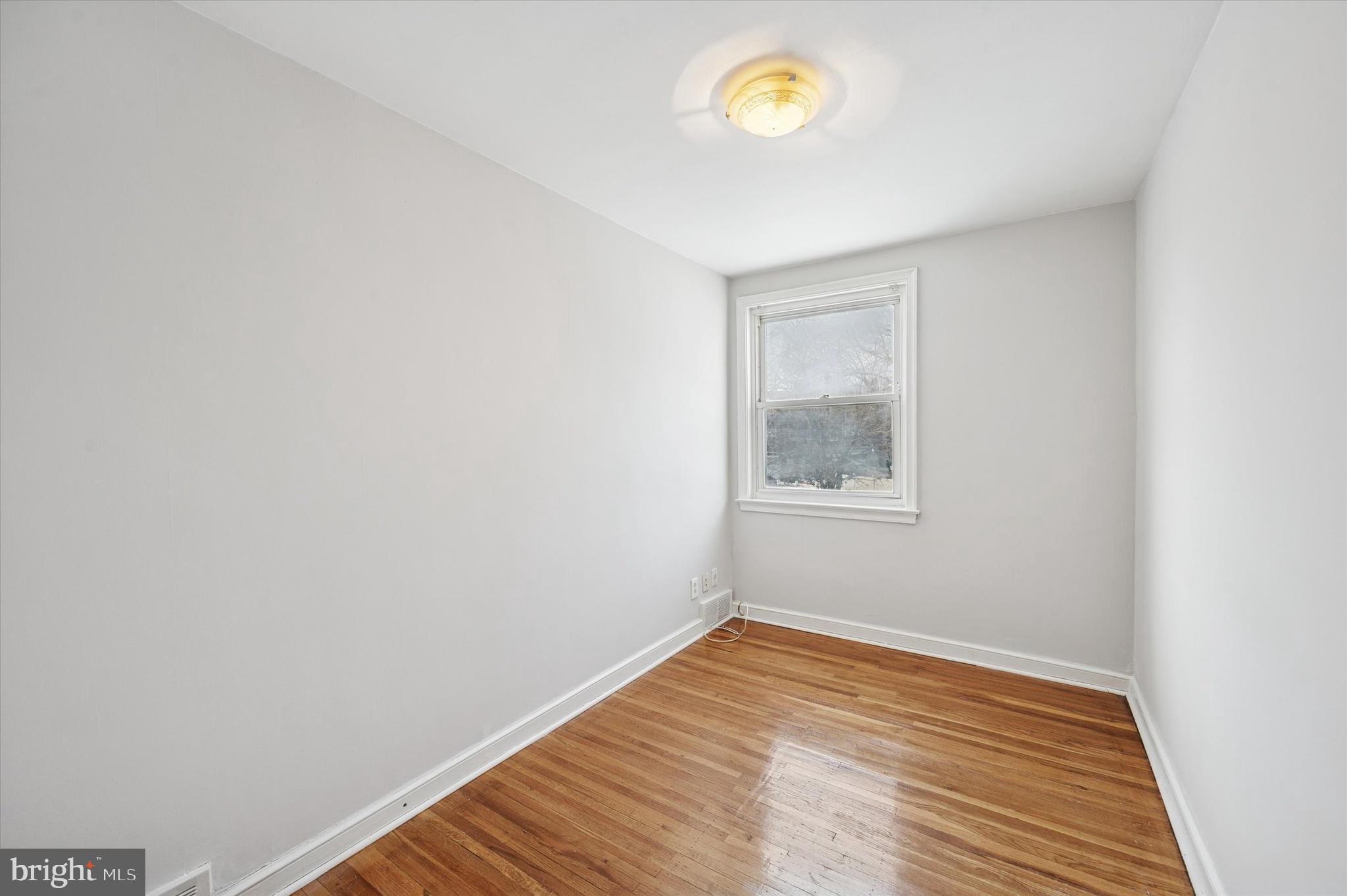 6320 Everett Street Philadelphia, PA 19149 - Photo 7 of 12 a view of a room that has wooden floor and a window