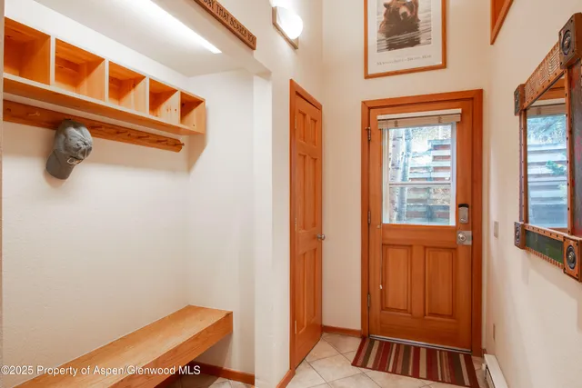 a balcony with furniture and a potted plant