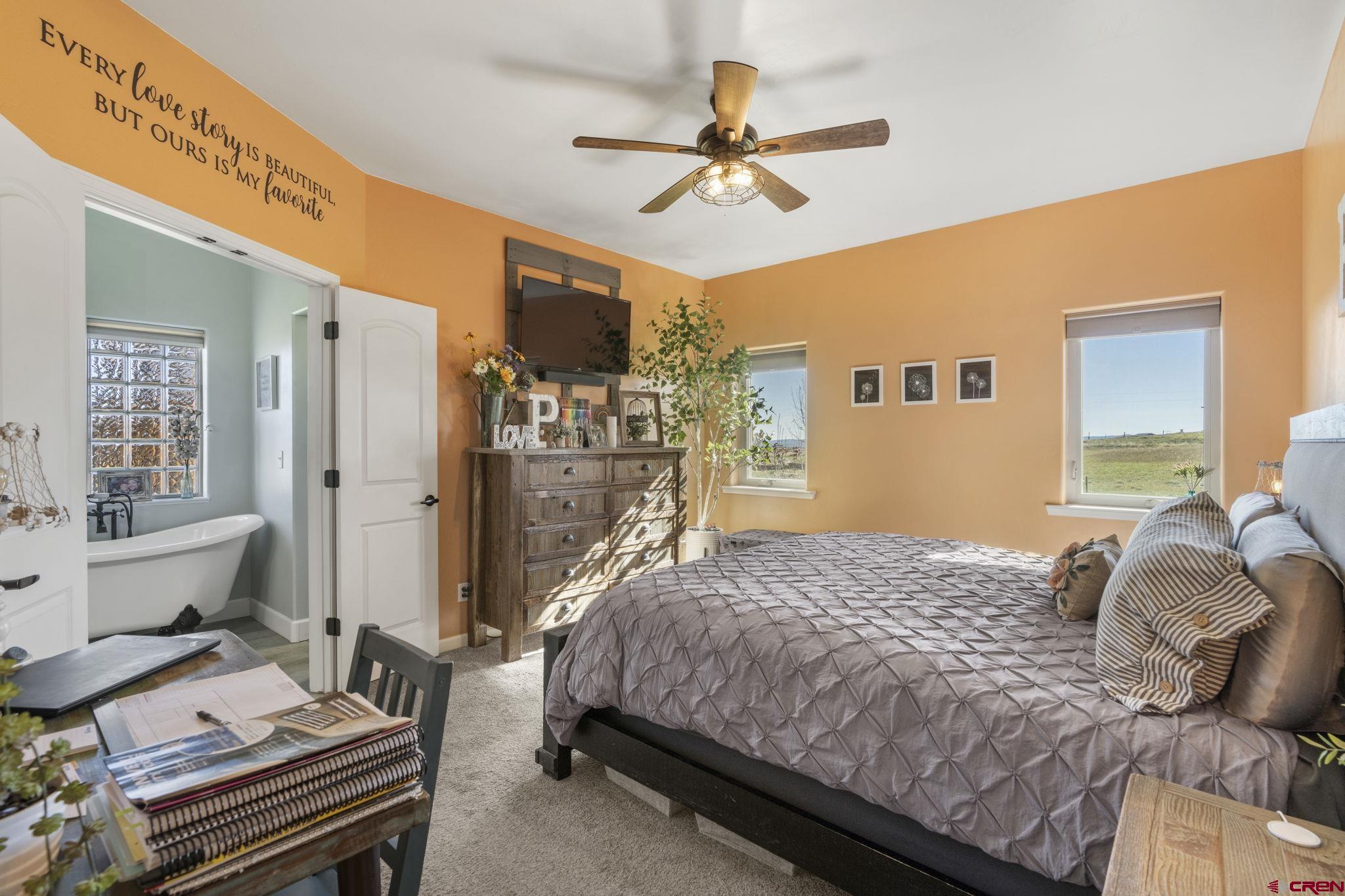 172 Encantado Lane Durango, CO 81303 - Photo 19 of 38 a bedroom with a bed dresser and a window