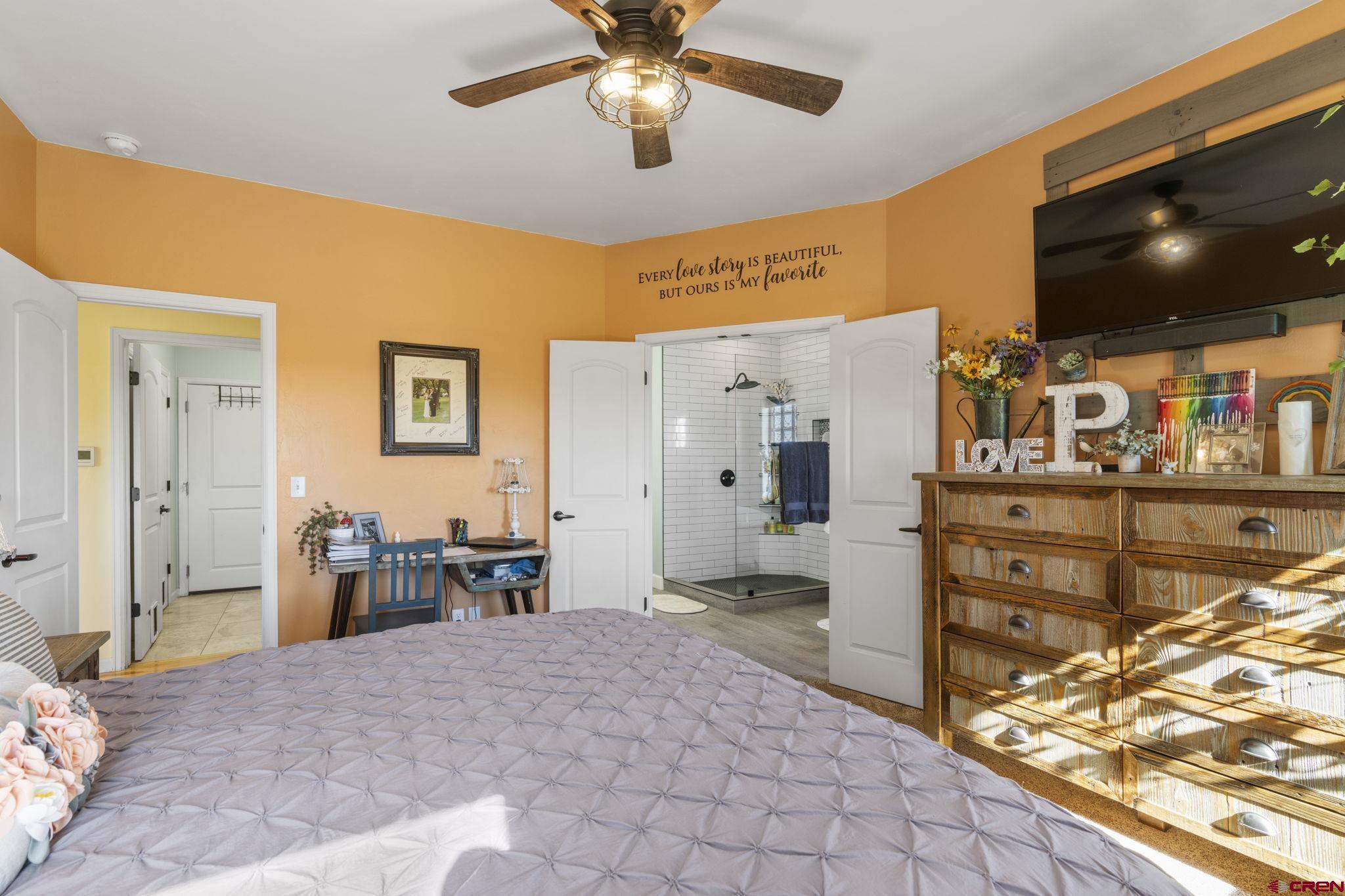 172 Encantado Lane Durango, CO 81303 - Photo 20 of 38 a view of a livingroom with furniture and a flat screen tv