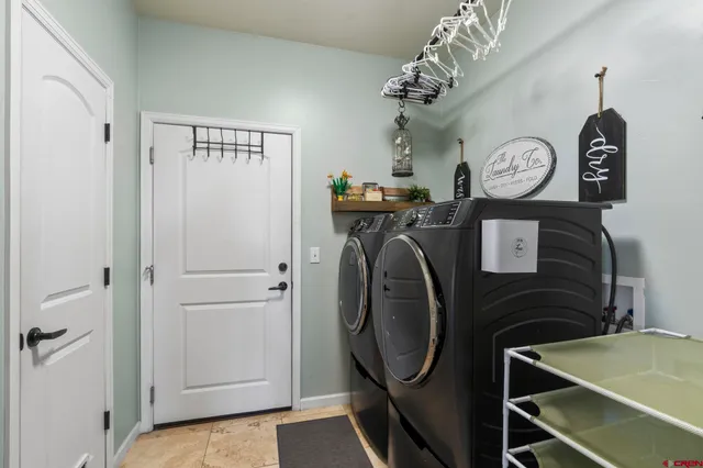 a view of a hallway with washer and dryer