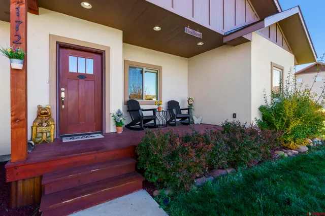 a view of front door and porch with seating space