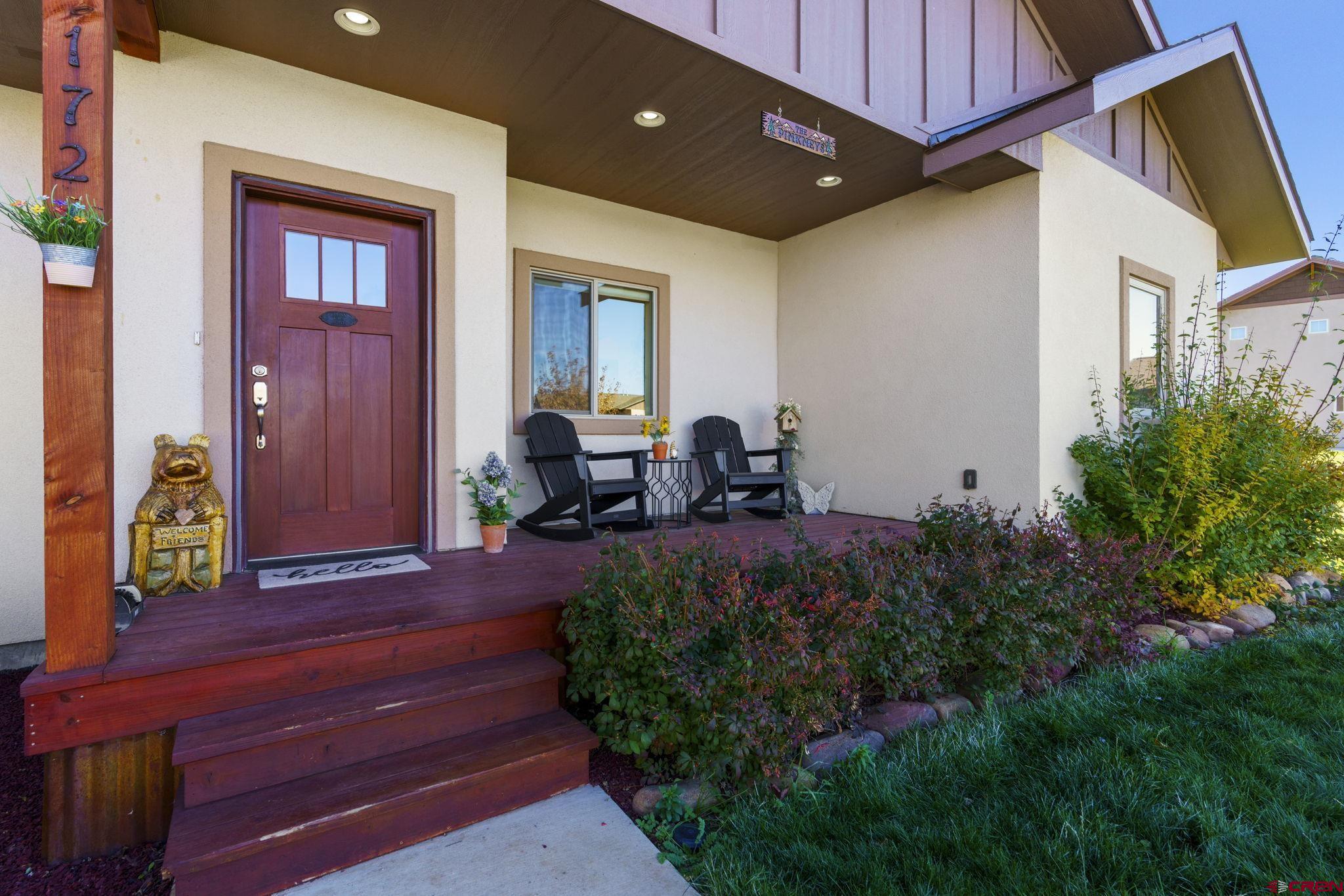 172 Encantado Lane Durango, CO 81303 - Photo 28 of 38 a view of front door and porch with seating space