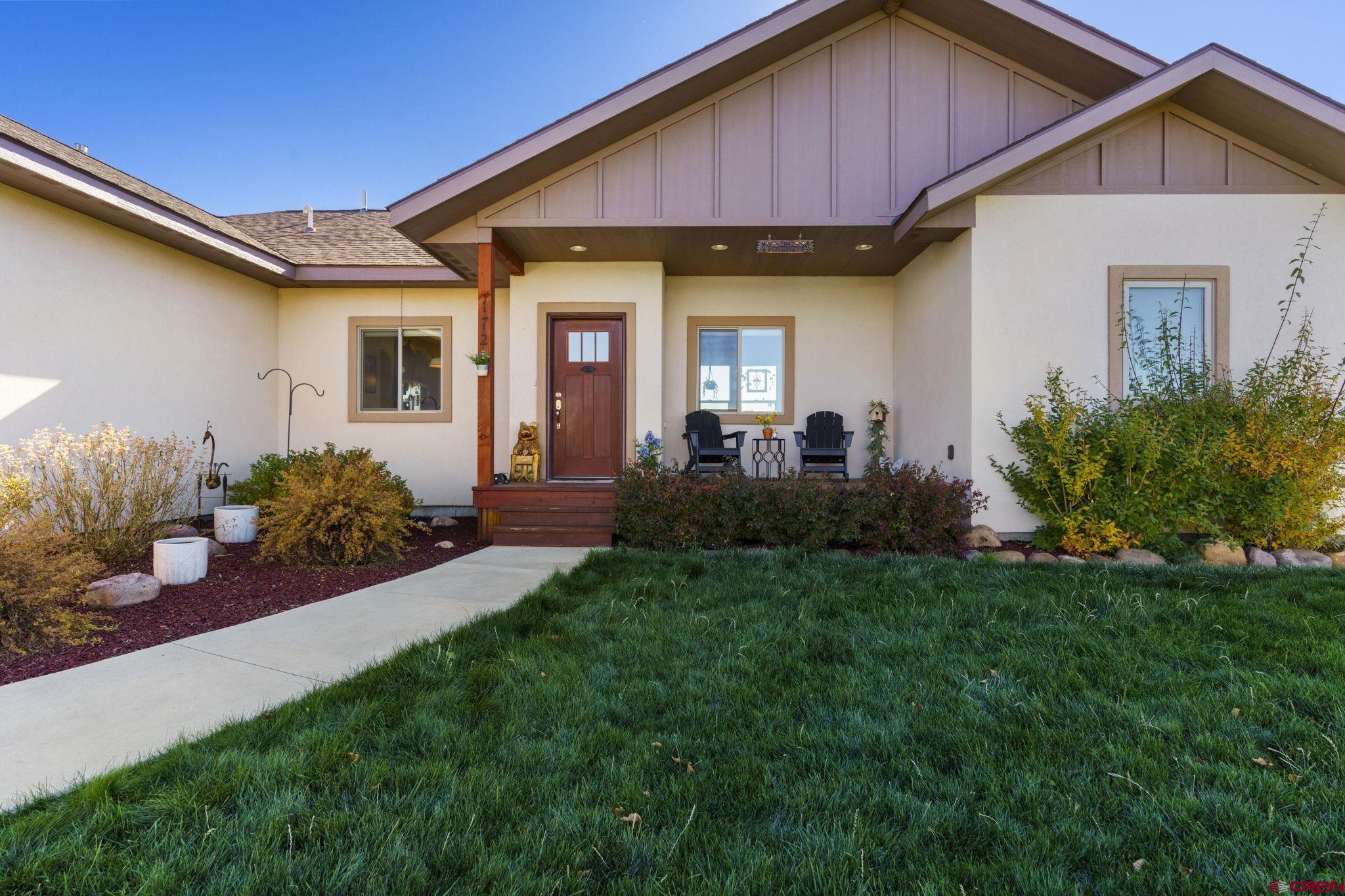 172 Encantado Lane Durango, CO 81303 - Photo 29 of 38 a front view of a house with garden