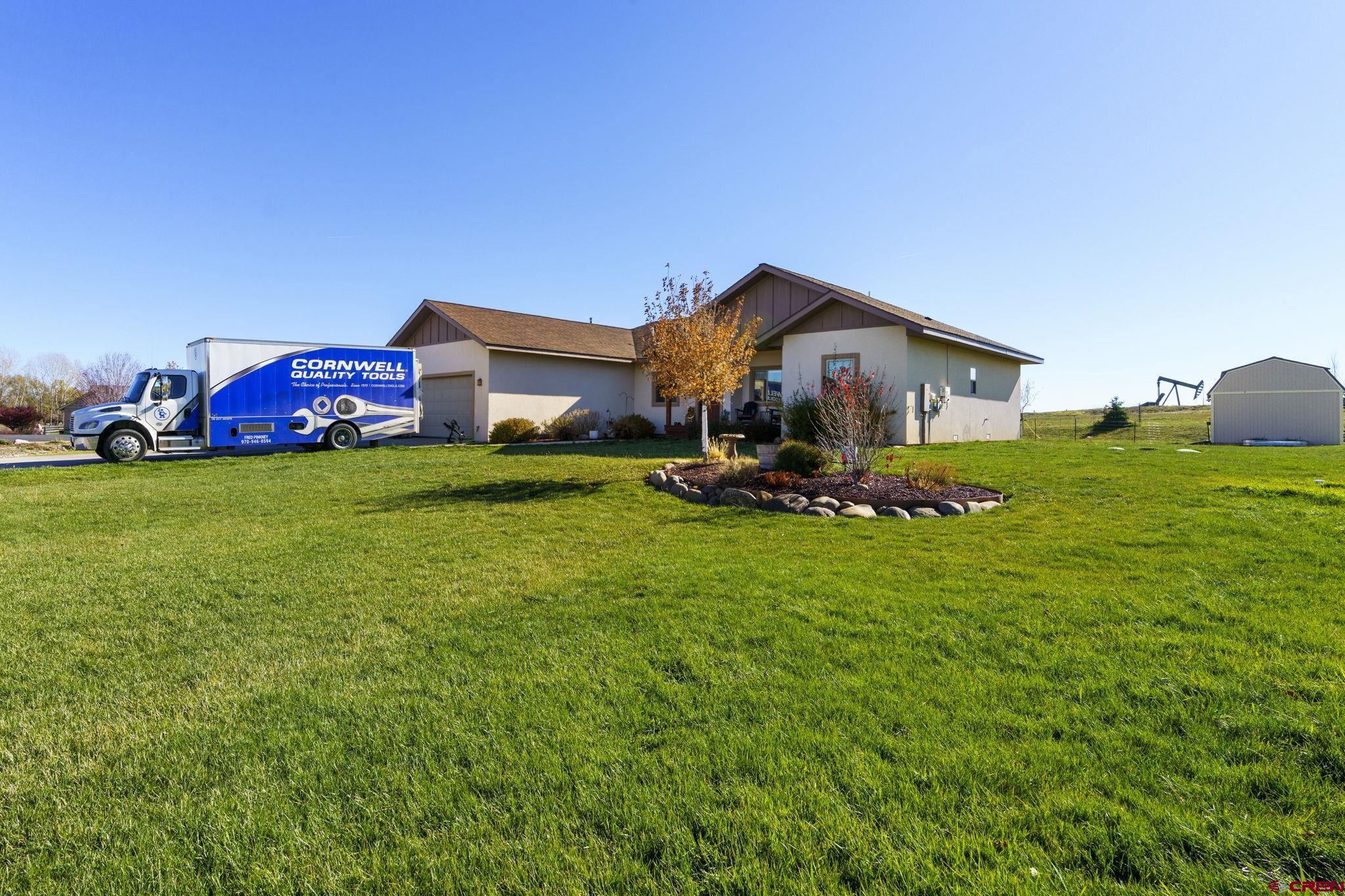 172 Encantado Lane Durango, CO 81303 - Photo 30 of 38 a front view of a house with garden
