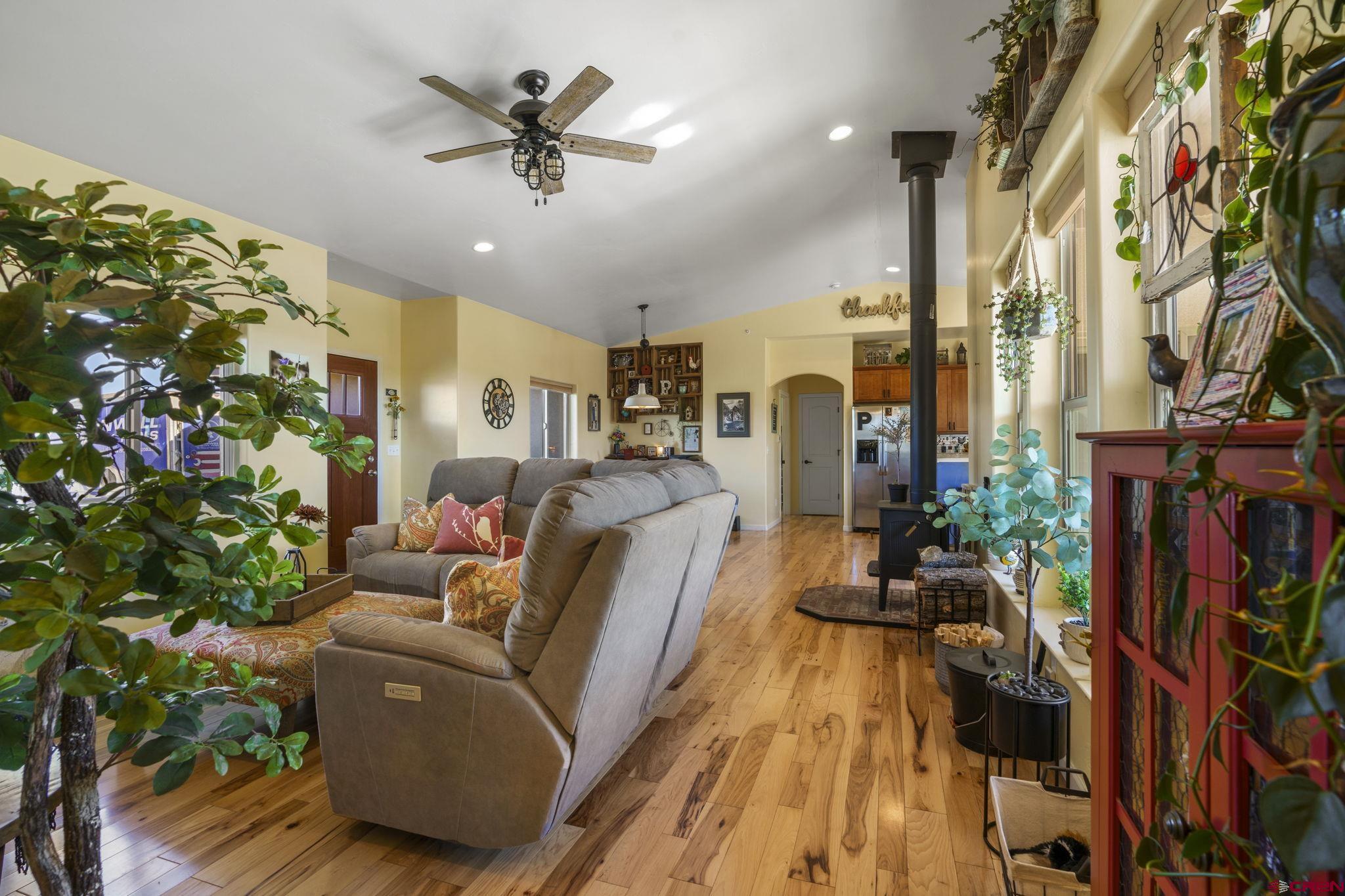172 Encantado Lane Durango, CO 81303 - Photo 3 of 38 a living room with furniture and a potted plant