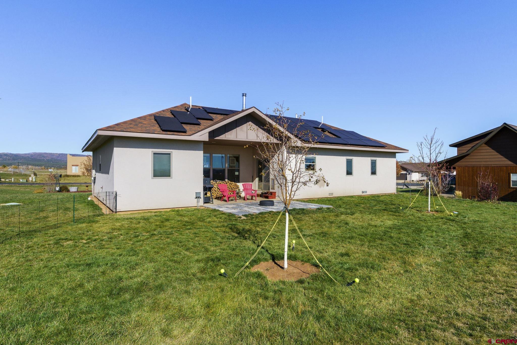 172 Encantado Lane Durango, CO 81303 - Photo 32 of 38 a front view of a house with a garden