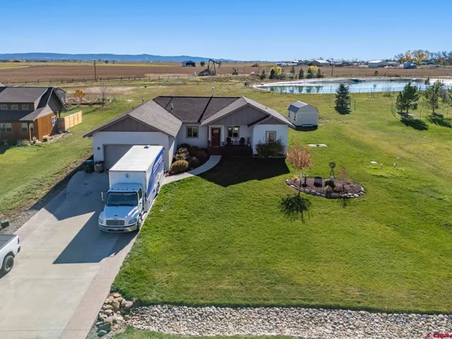 an aerial view of a house with a garden